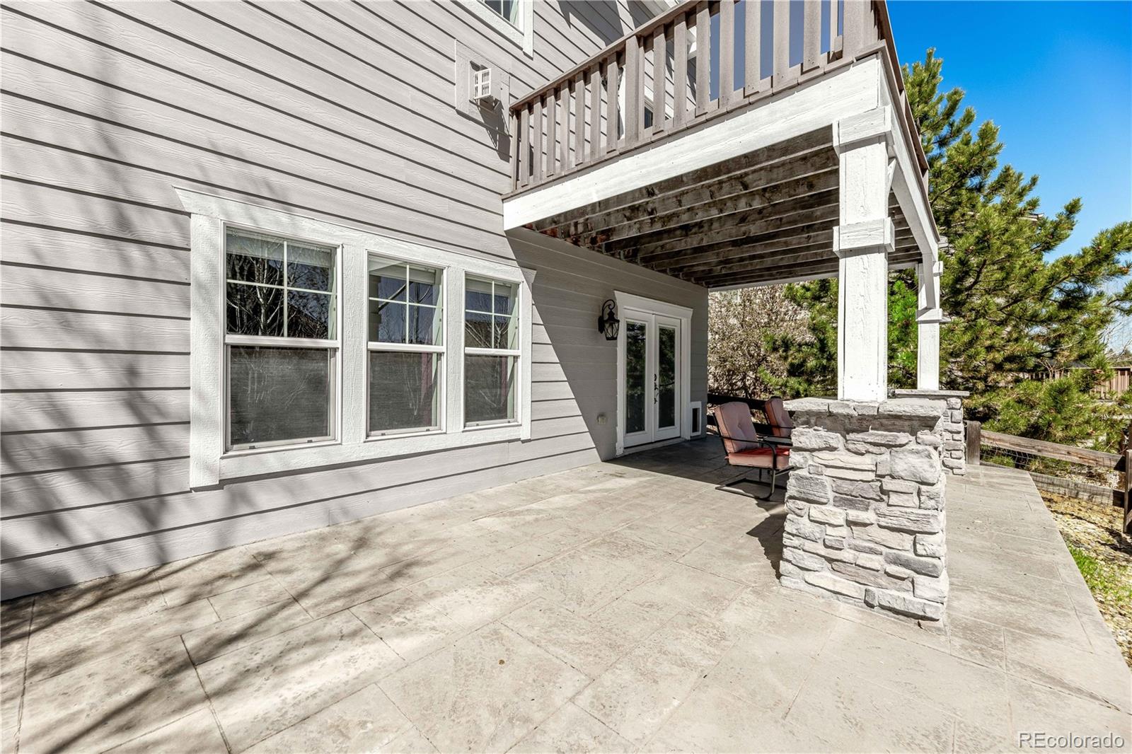 1610 Ridgetrail Court Castle Rock, CO 80104 - Photo 42 of 50 a view of house with backyard and outdoor seating