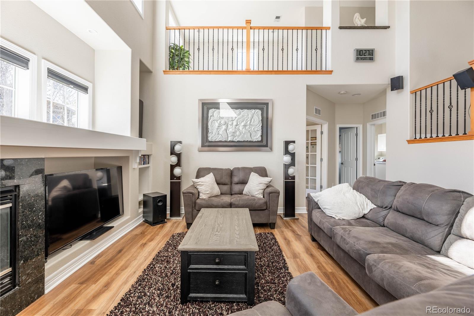 1610 Ridgetrail Court Castle Rock, CO 80104 - Photo 9 of 50 a living room with furniture and a fireplace