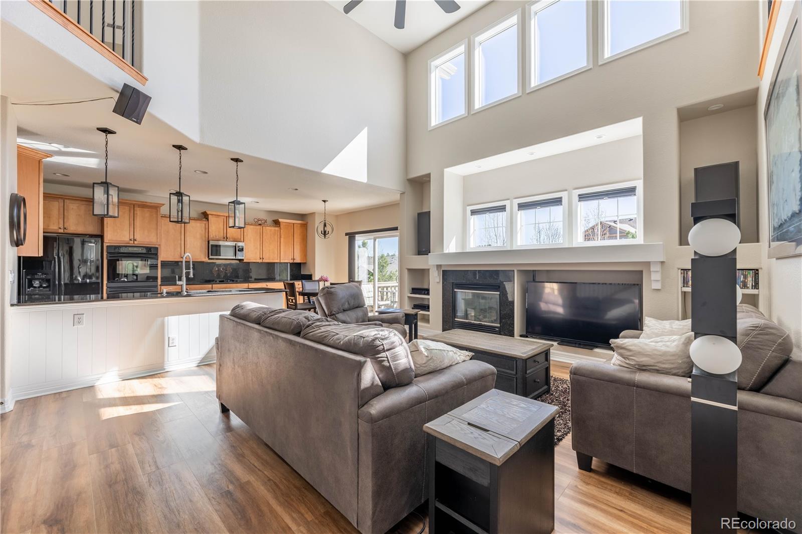 1610 Ridgetrail Court Castle Rock, CO 80104 - Photo 10 of 50 a living room with furniture and a fireplace