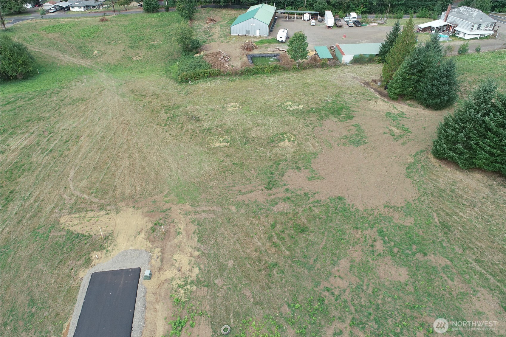 124 Norms Place Ariel, WA 98603 - Photo 5 of 9 a backyard of a house with lots of green space