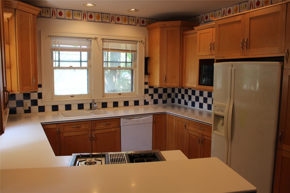 2826 Salado Street Austin, TX 78705 - Photo 13 of 29 a kitchen with a refrigerator and a sink
