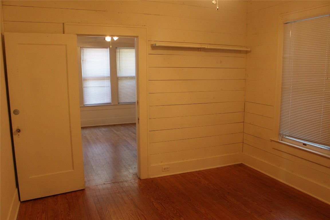 2826 Salado Street Austin, TX 78705 - Photo 15 of 29 a view of a small space with wooden floor and a window