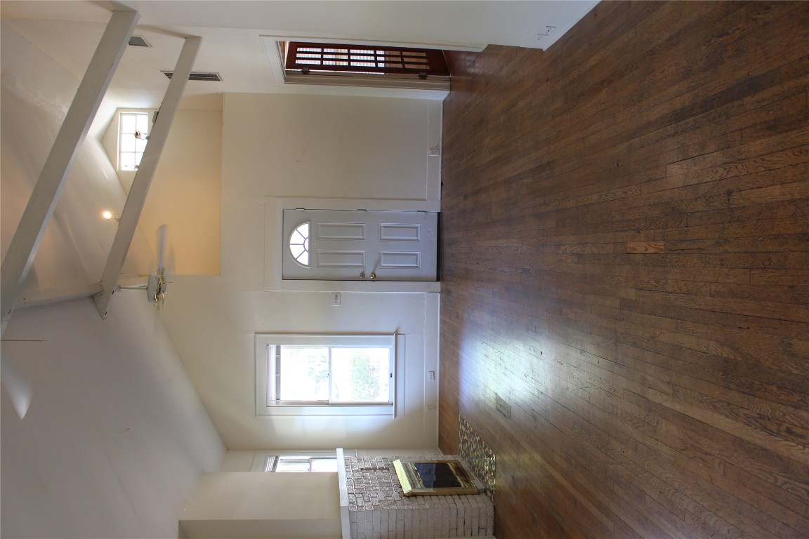 2826 Salado Street Austin, TX 78705 - Photo 20 of 29 an empty room with wooden floor and windows