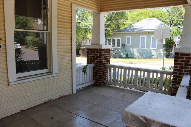 a front view of a house with a porch