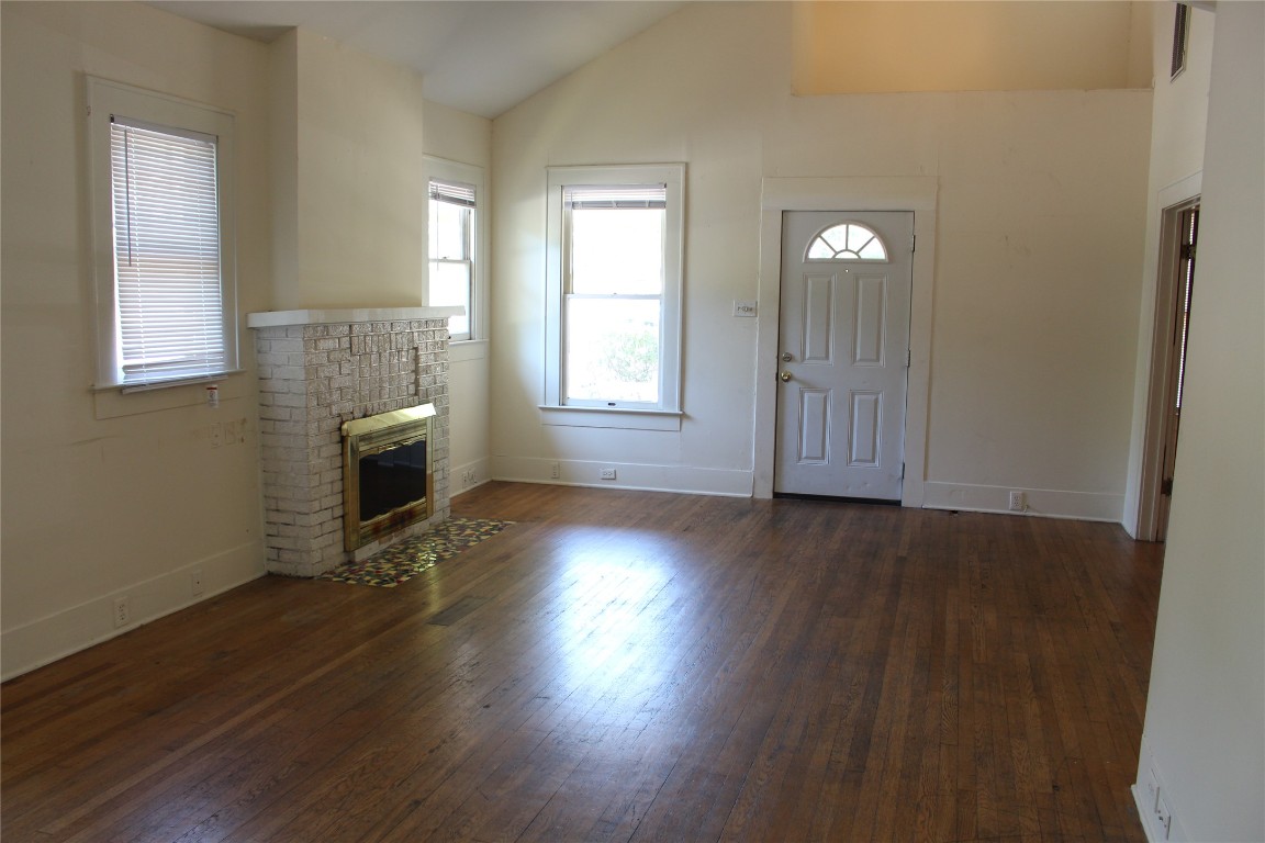 2826 Salado Street Austin, TX 78705 - Photo 9 of 29 an empty room with wooden floor and windows