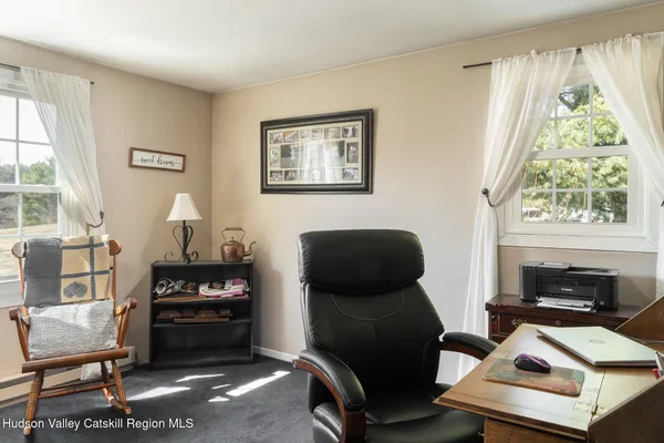 a living room with fireplace furniture and a flat screen tv