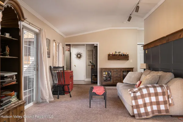 a view of a livingroom with wooden floor and closet