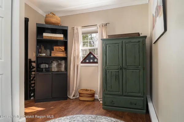 a bedroom with a bed and lamp