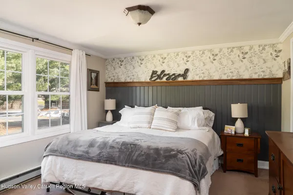 a living room with furniture a window and a fireplace