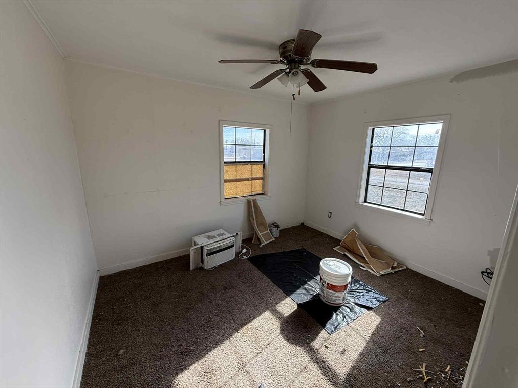 110 Hickory Street Roscoe, TX 79545 - Photo 6 of 9 a living room with furniture and a window