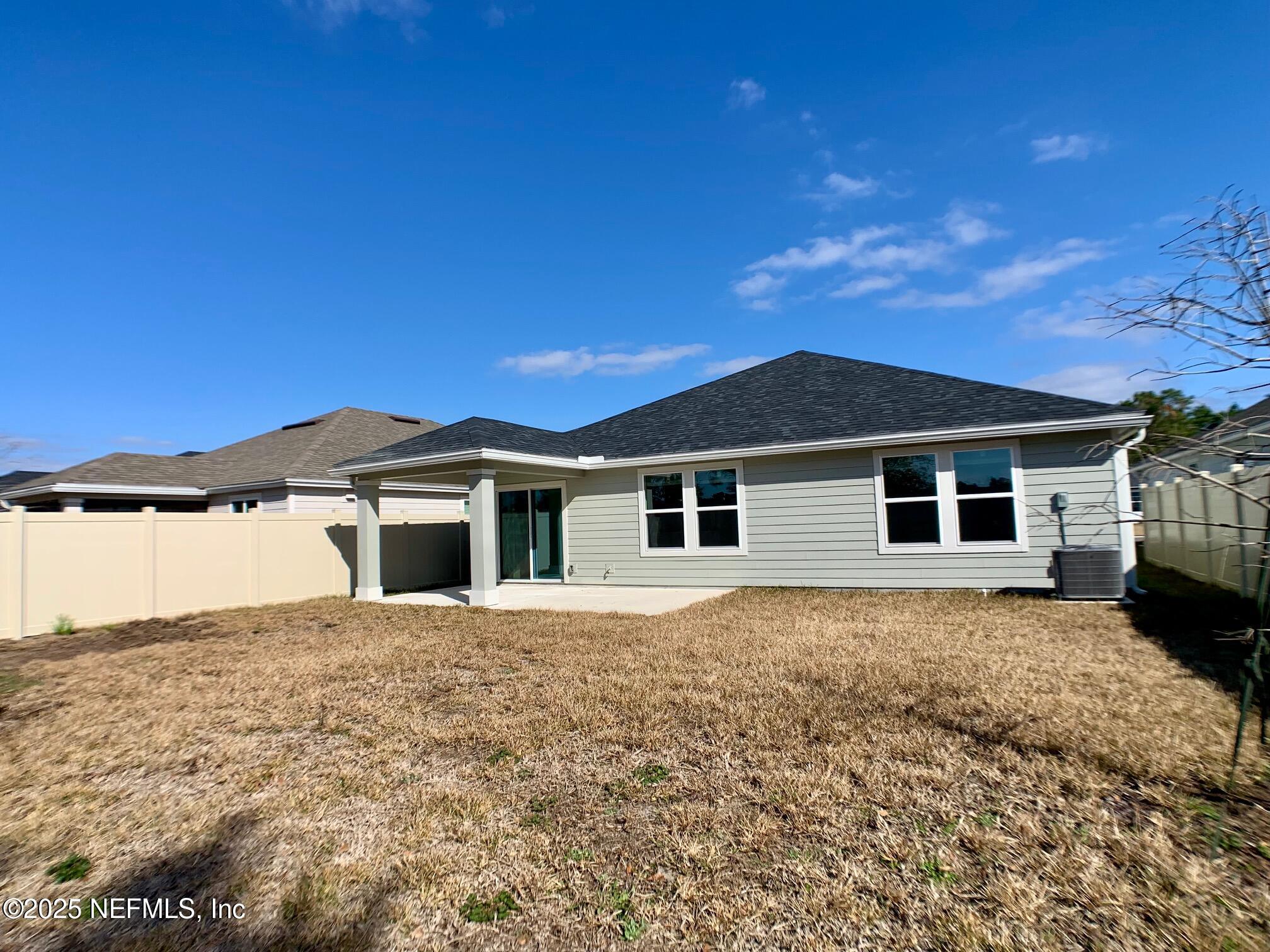 7948 Rippa Vly Way Jacksonville, FL 32222 - Photo 27 of 30 a front view of a house with a yard