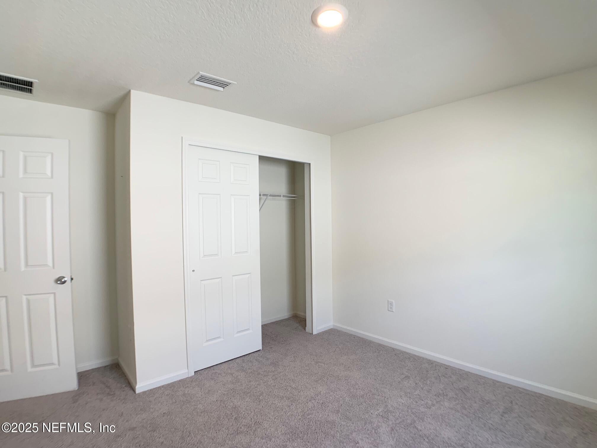 7948 Rippa Vly Way Jacksonville, FL 32222 - Photo 5 of 30 a view of an empty room