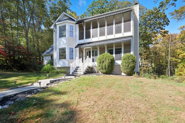 front view of a house with a yard