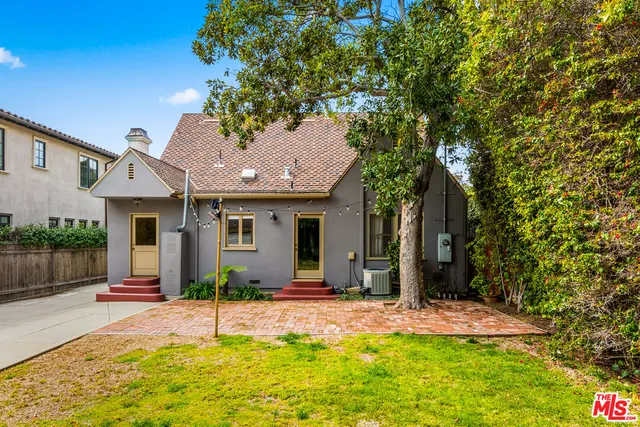a house with trees in the background