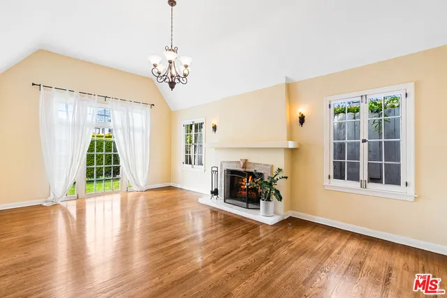 a view of an room with wooden floor and windows
