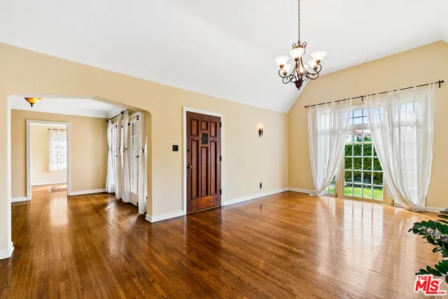 a view of an entryway with wooden floor