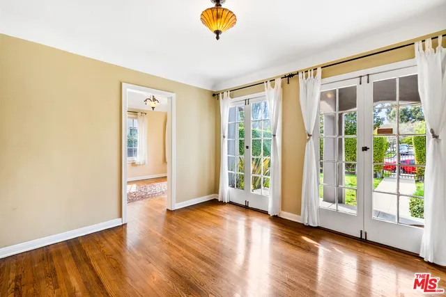 a view of a room with wooden floor and fireplace