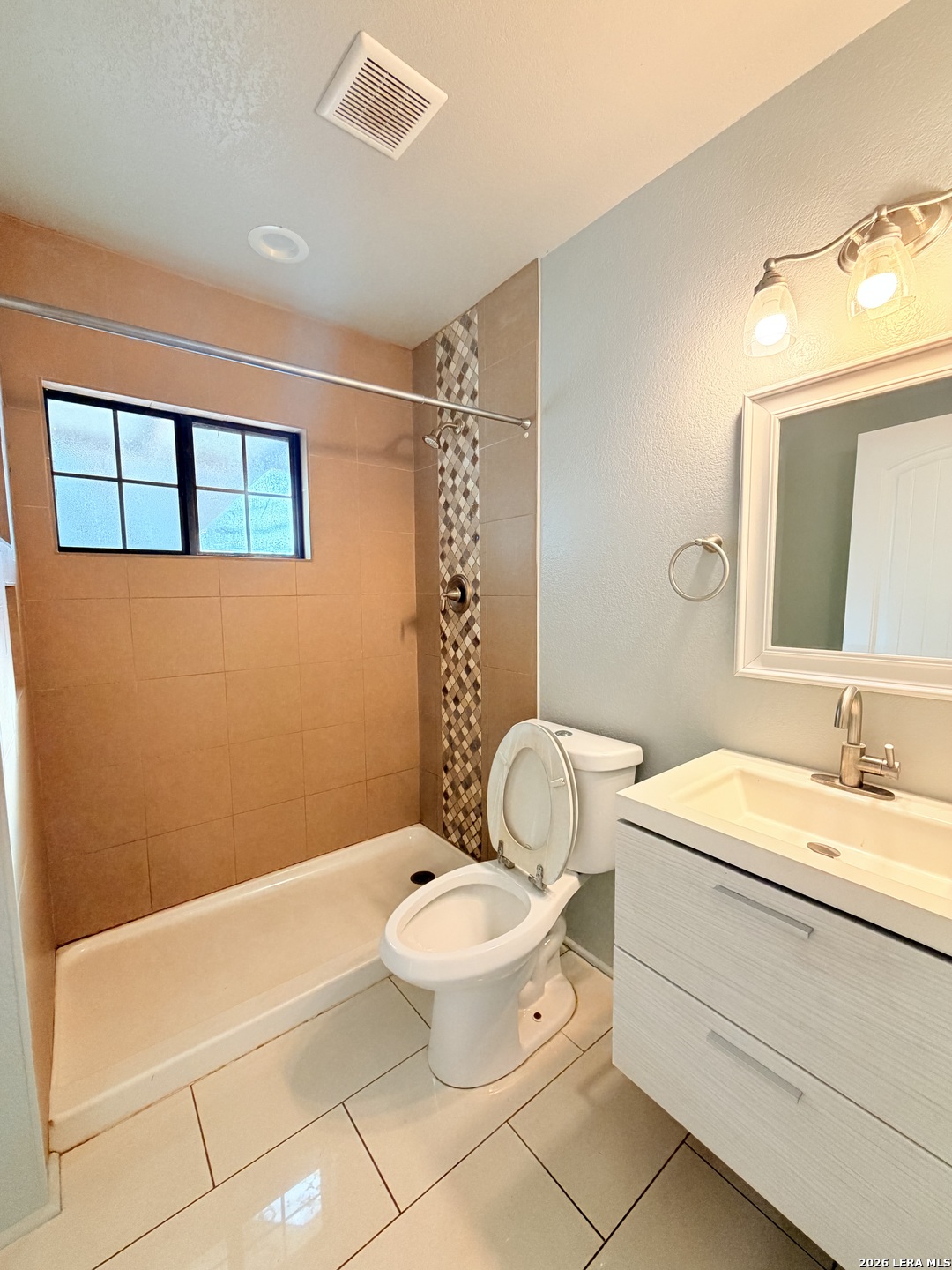 255 Cumberland Road San Antonio, TX 78204 - Photo 12 of 18 a bathroom with a sink a toilet and mirror