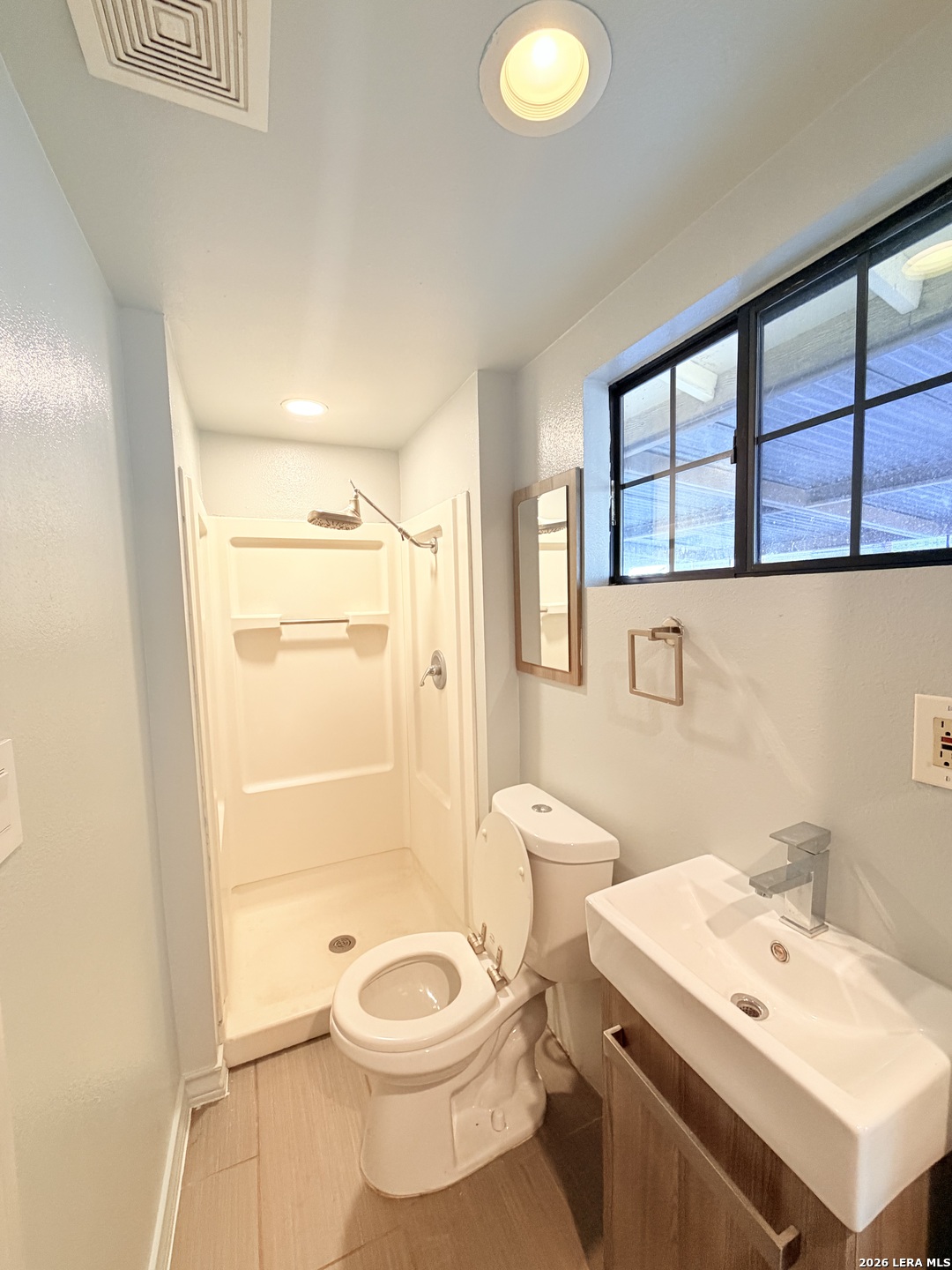 255 Cumberland Road San Antonio, TX 78204 - Photo 15 of 18 a bathroom with a sink a toilet and shower