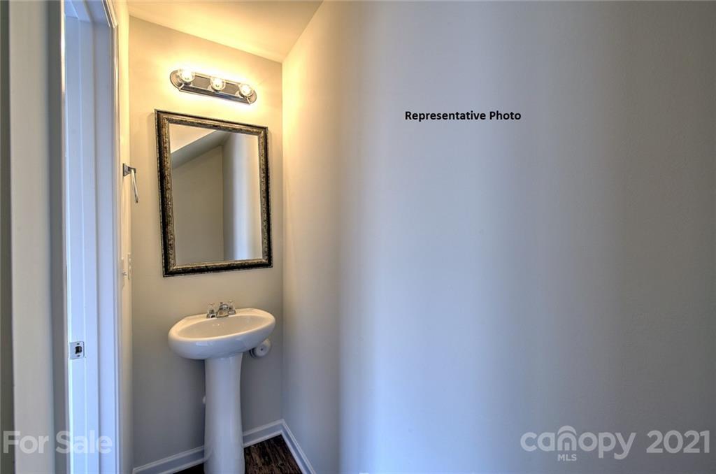 7112 Finnigan Road Charlotte, NC 28215 - Photo 22 of 33 a bathroom with a sink and mirror
