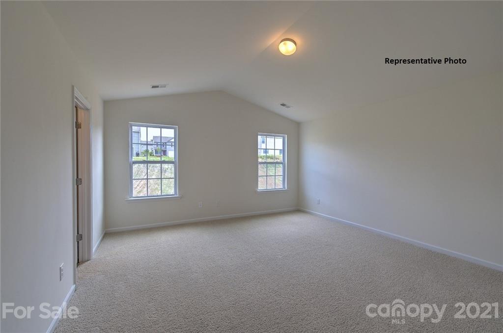 7112 Finnigan Road Charlotte, NC 28215 - Photo 23 of 33 a view of an empty room with a window