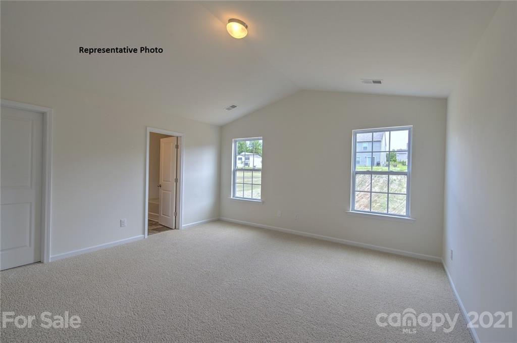 7112 Finnigan Road Charlotte, NC 28215 - Photo 26 of 33 a view of an empty room with a window