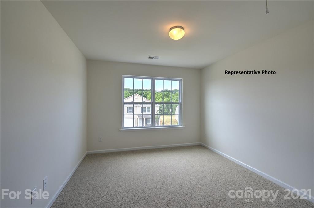 7112 Finnigan Road Charlotte, NC 28215 - Photo 31 of 33 an empty room with windows