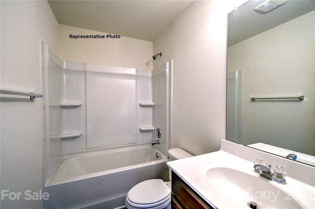 7112 Finnigan Road Charlotte, NC 28215 - Photo 32 of 33 a bathroom with a sink toilet and shower