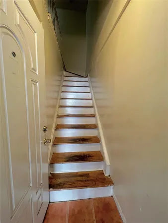 a view of a hallway with staircase