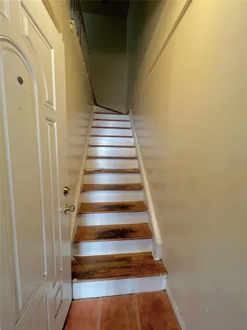 a view of a hallway with staircase