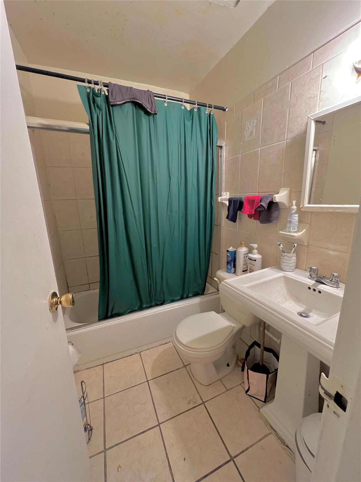 620 East 182nd Street Bronx, NY 10457 - Photo 6 of 9 a bathroom with a sink and a mirror