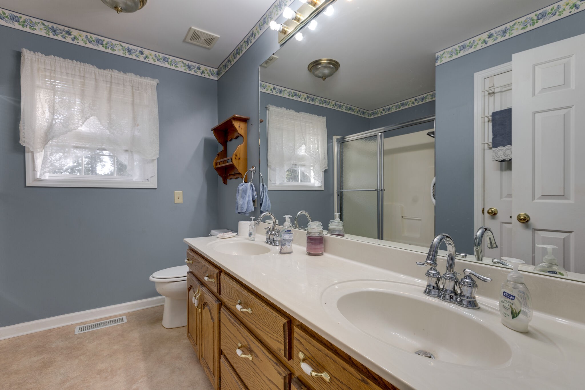 10 Harding Road Leoma, TN 38468 - Photo 16 of 26 a bathroom with a double vanity sink and a mirror