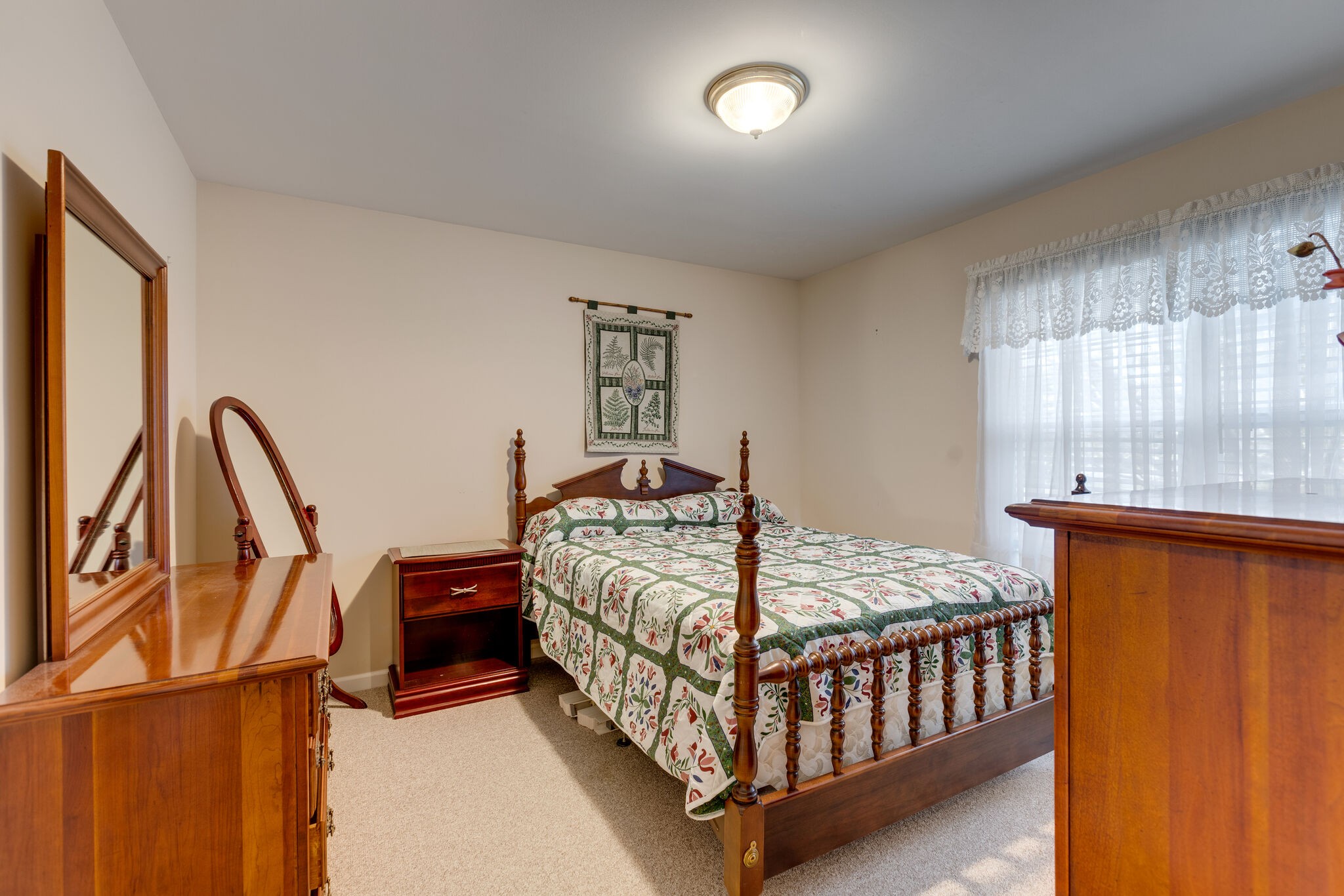 10 Harding Road Leoma, TN 38468 - Photo 17 of 26 a bedroom with a bed next to a large window