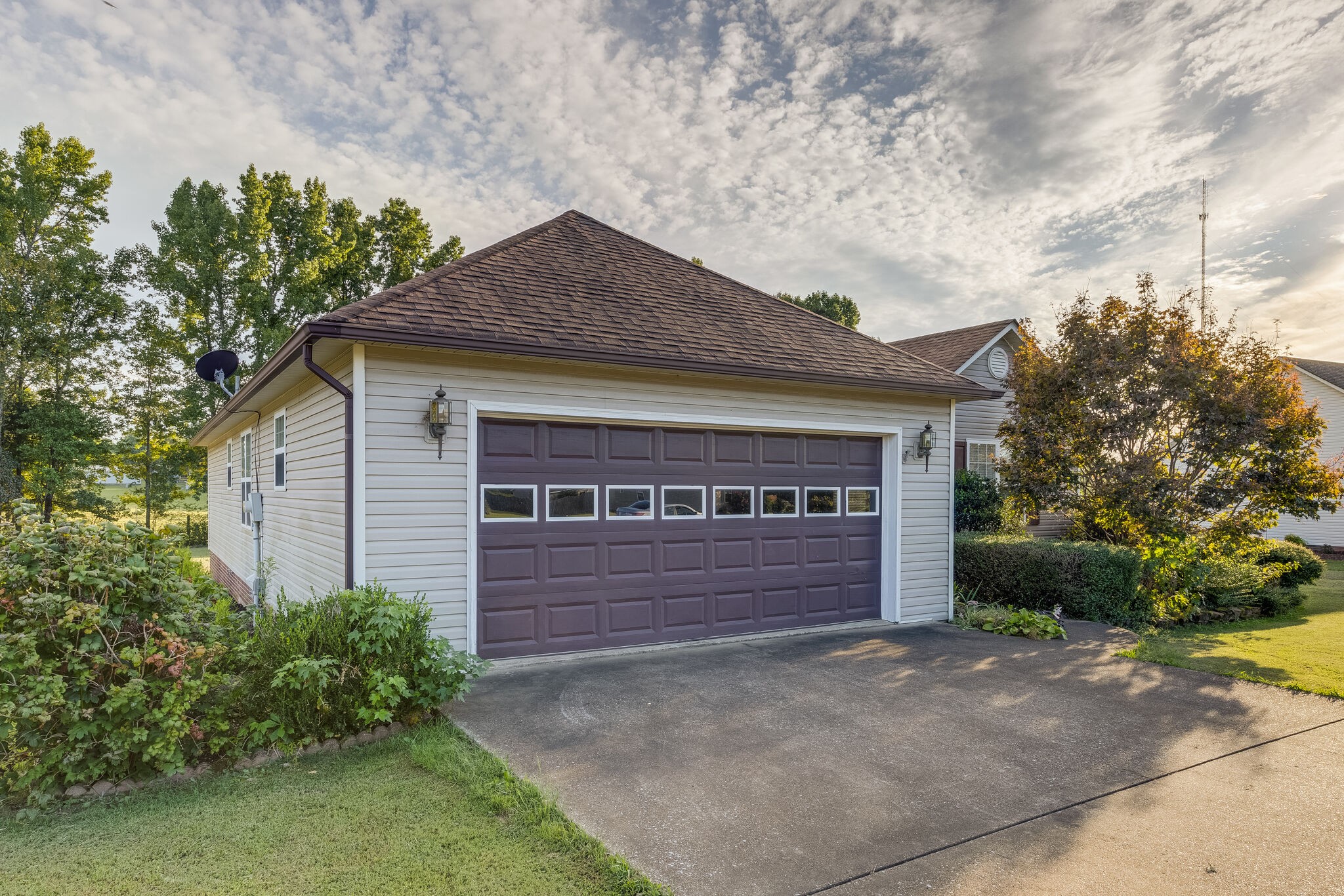 10 Harding Road Leoma, TN 38468 - Photo 5 of 26 a front view of a house with a yard and garage
