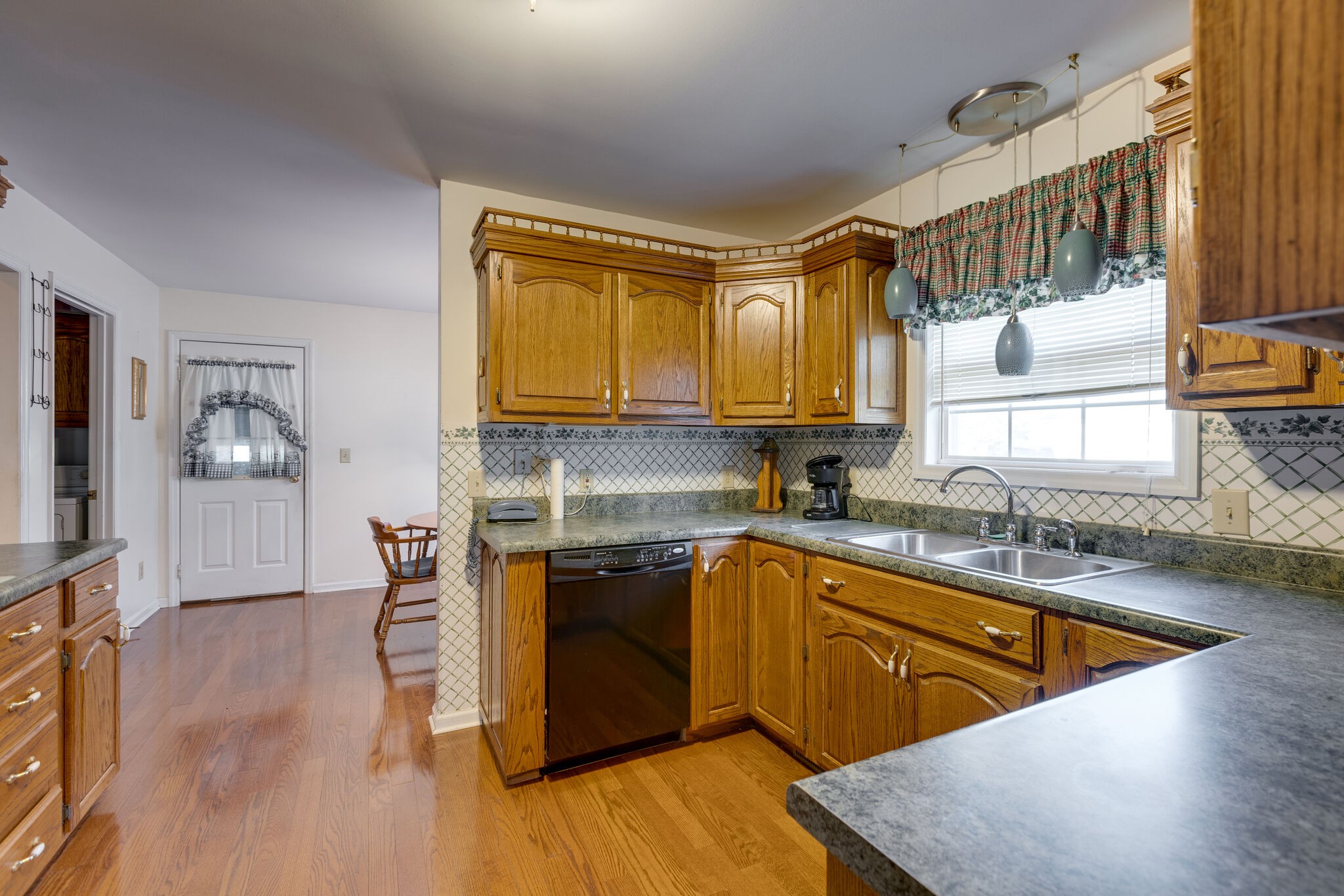 10 Harding Road Leoma, TN 38468 - Photo 9 of 26 a kitchen with stainless steel appliances granite countertop wooden cabinets a sink and a stove