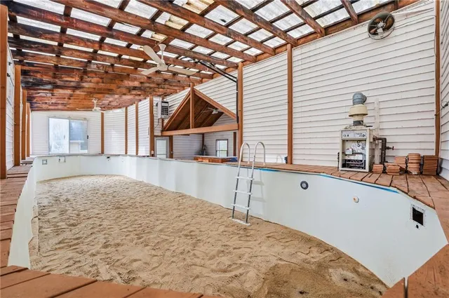 a view of a house with a backyard and a tub