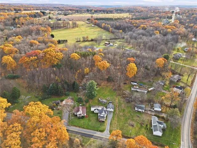 an aerial view of residential houses with outdoor space