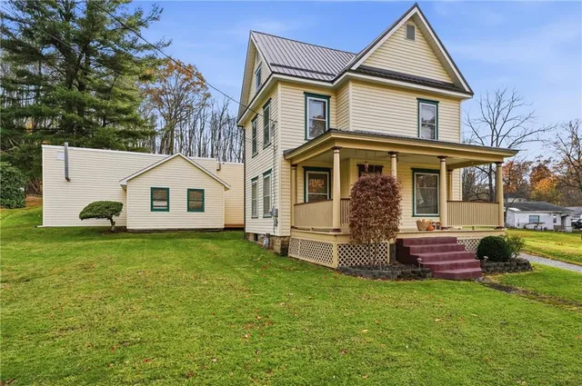 a front view of a house with garden