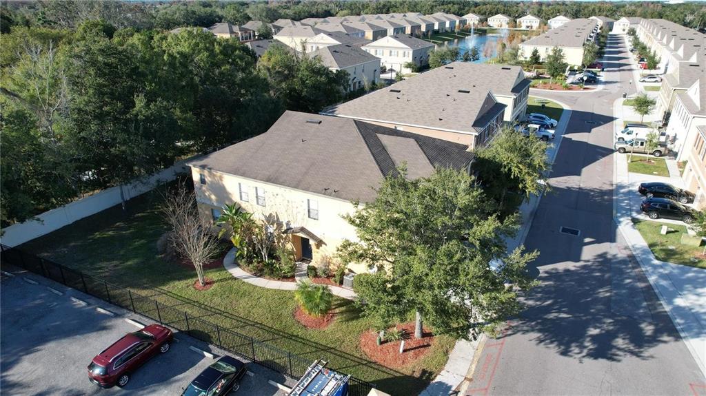 3739 Seneca Club Loop, Unit A Orlando, FL 32808 - Photo 23 of 31 an aerial view of multiple houses with yard