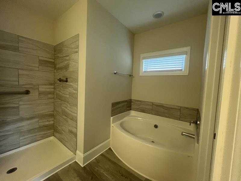 516 Mitscher Way Chapin, SC 29036 - Photo 7 of 18 a bathroom with a bathtub