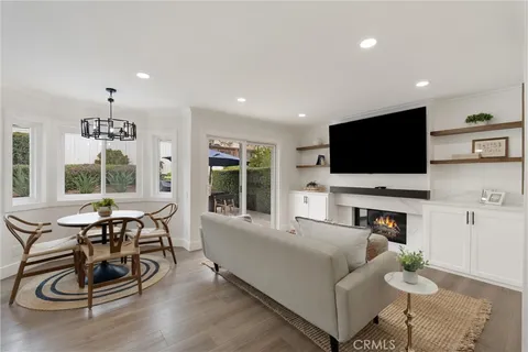 a living room with fireplace furniture and a flat screen tv