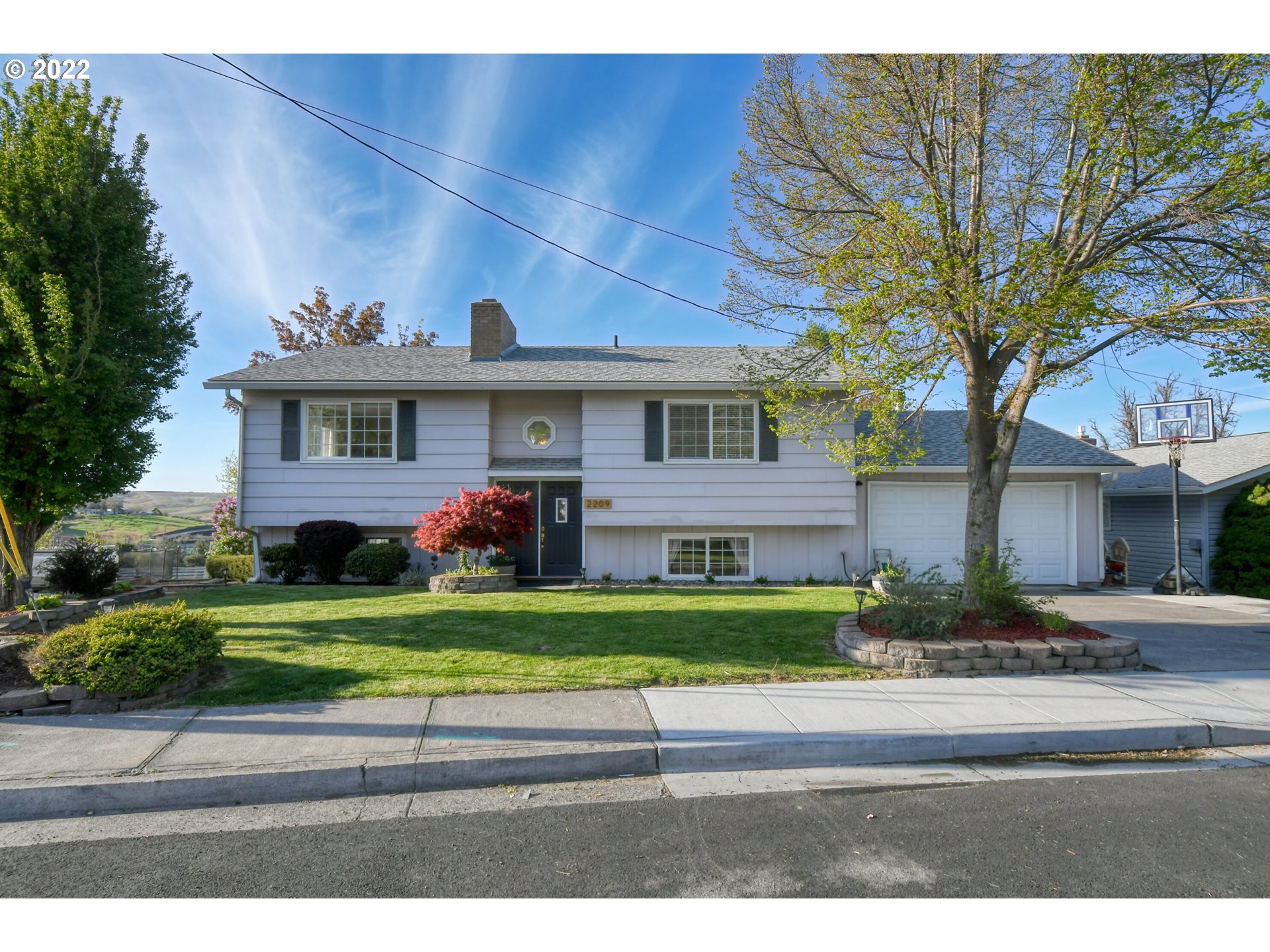 2209 Southwest Ladow Avenue Pendleton, OR 97801 - Photo 1 of 24 a front view of a house with a yard