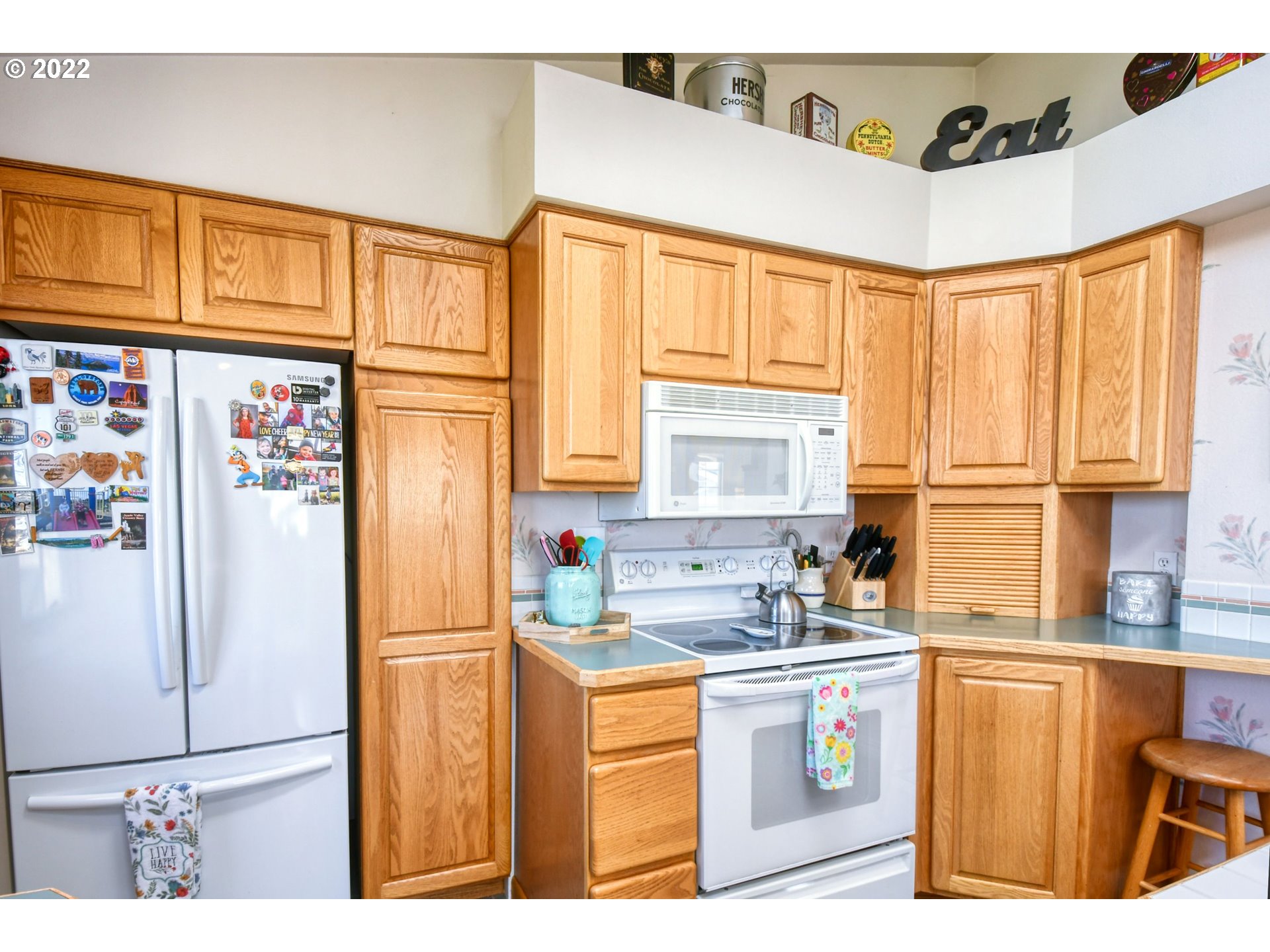 2209 Southwest Ladow Avenue Pendleton, OR 97801 - Photo 11 of 24 a kitchen with stainless steel appliances a refrigerator sink and cabinets