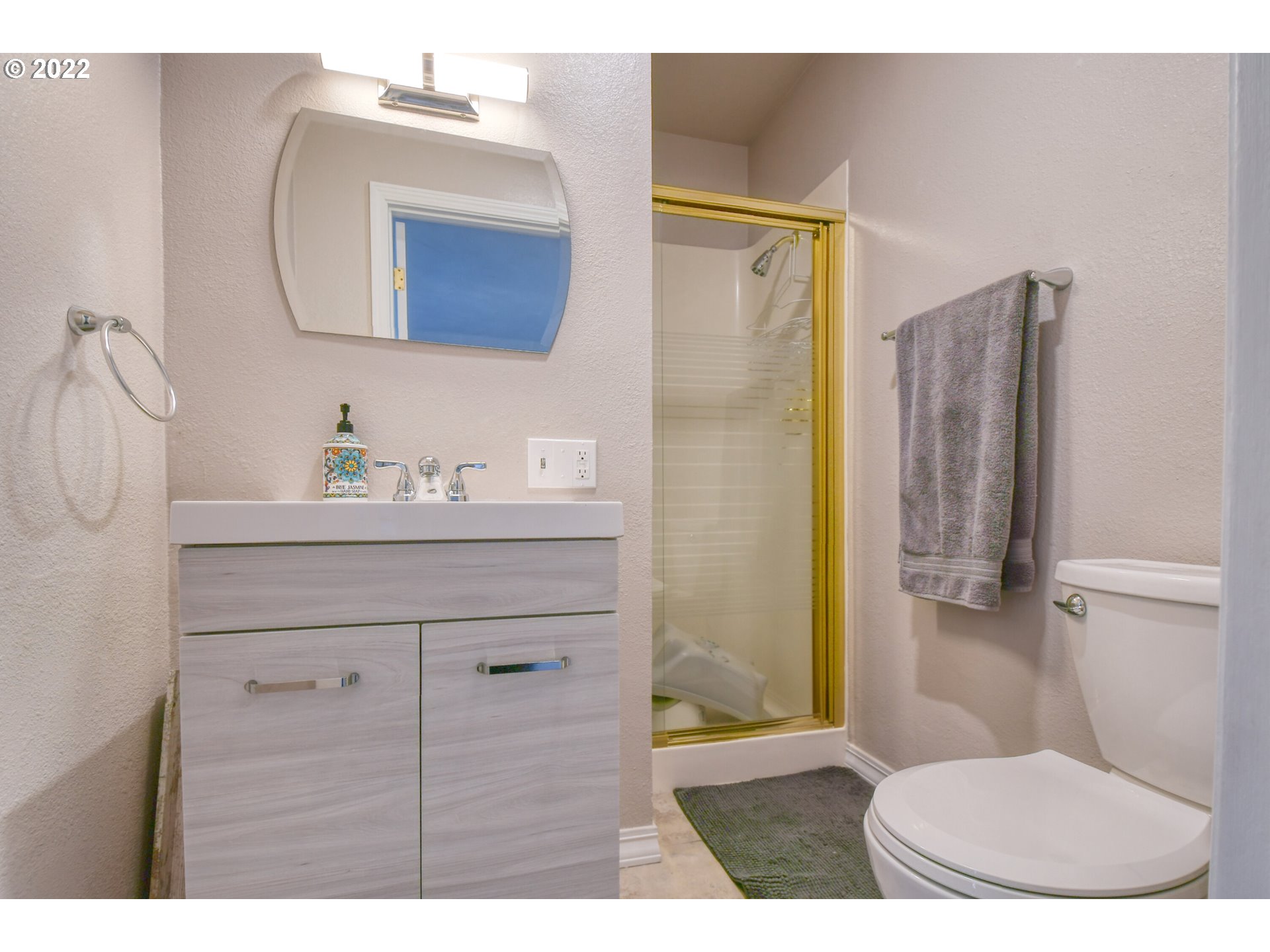 2209 Southwest Ladow Avenue Pendleton, OR 97801 - Photo 12 of 24 a bathroom with a sink a toilet and shower
