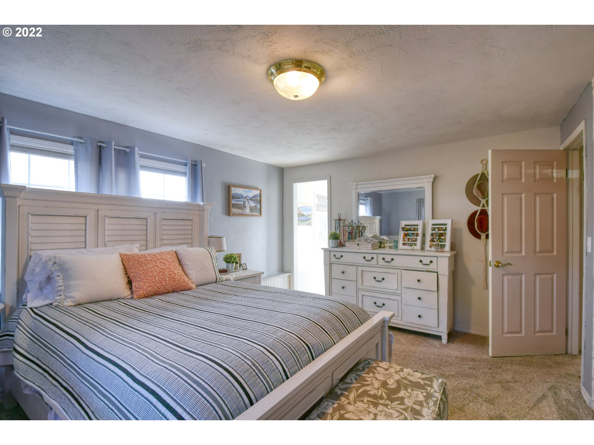 2209 Southwest Ladow Avenue Pendleton, OR 97801 - Photo 13 of 24 a bedroom with a bed and a dresser