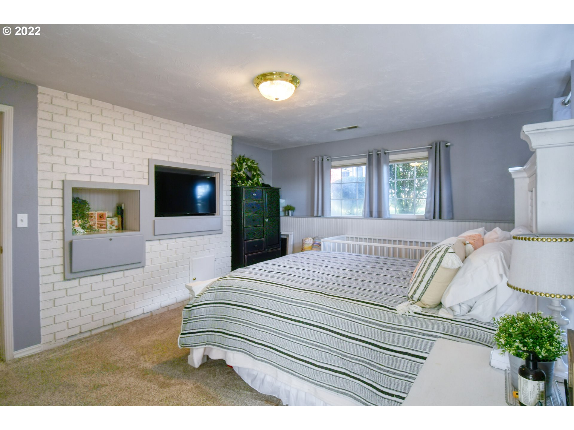 2209 Southwest Ladow Avenue Pendleton, OR 97801 - Photo 14 of 24 a bedroom with a bed and a couch