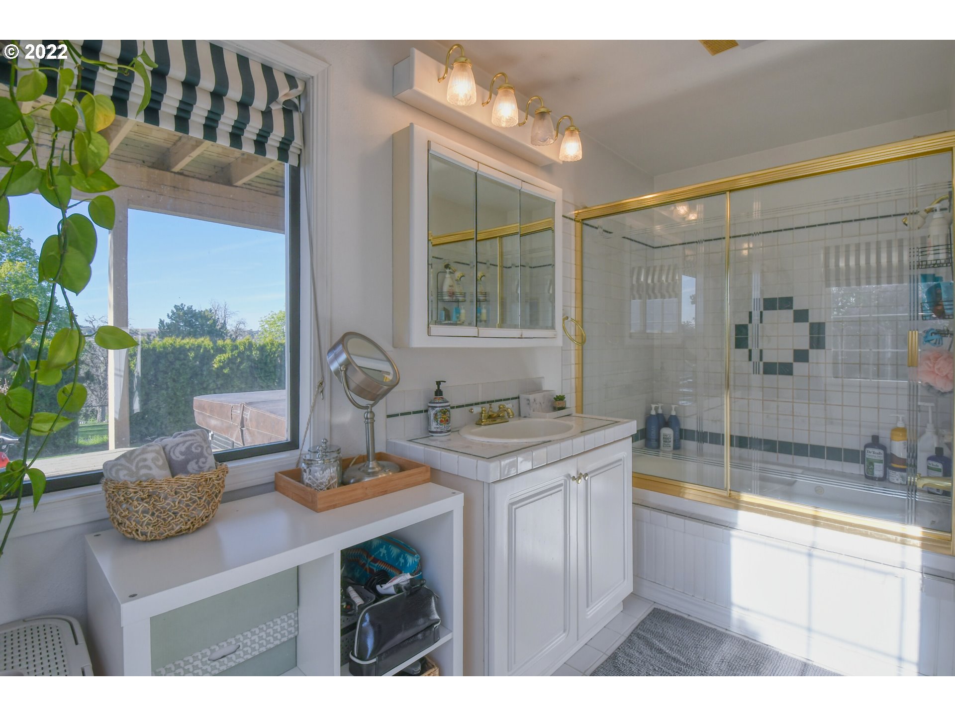 2209 Southwest Ladow Avenue Pendleton, OR 97801 - Photo 15 of 24 a bathroom with a granite countertop sink a toilet and shower