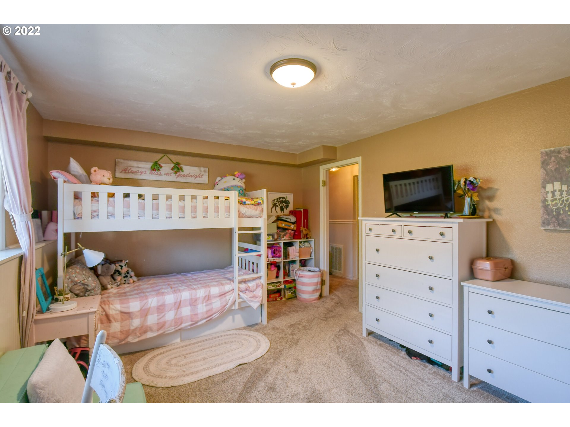 2209 Southwest Ladow Avenue Pendleton, OR 97801 - Photo 18 of 24 a bedroom with furniture and a flat screen tv