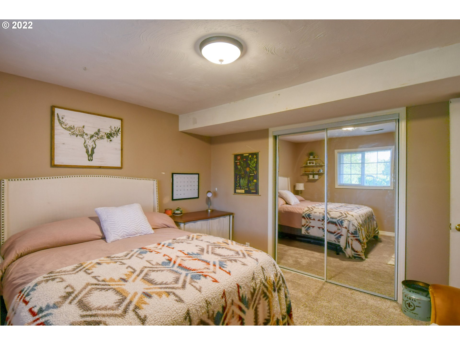 2209 Southwest Ladow Avenue Pendleton, OR 97801 - Photo 20 of 24 a bedroom with a bed and wooden floor