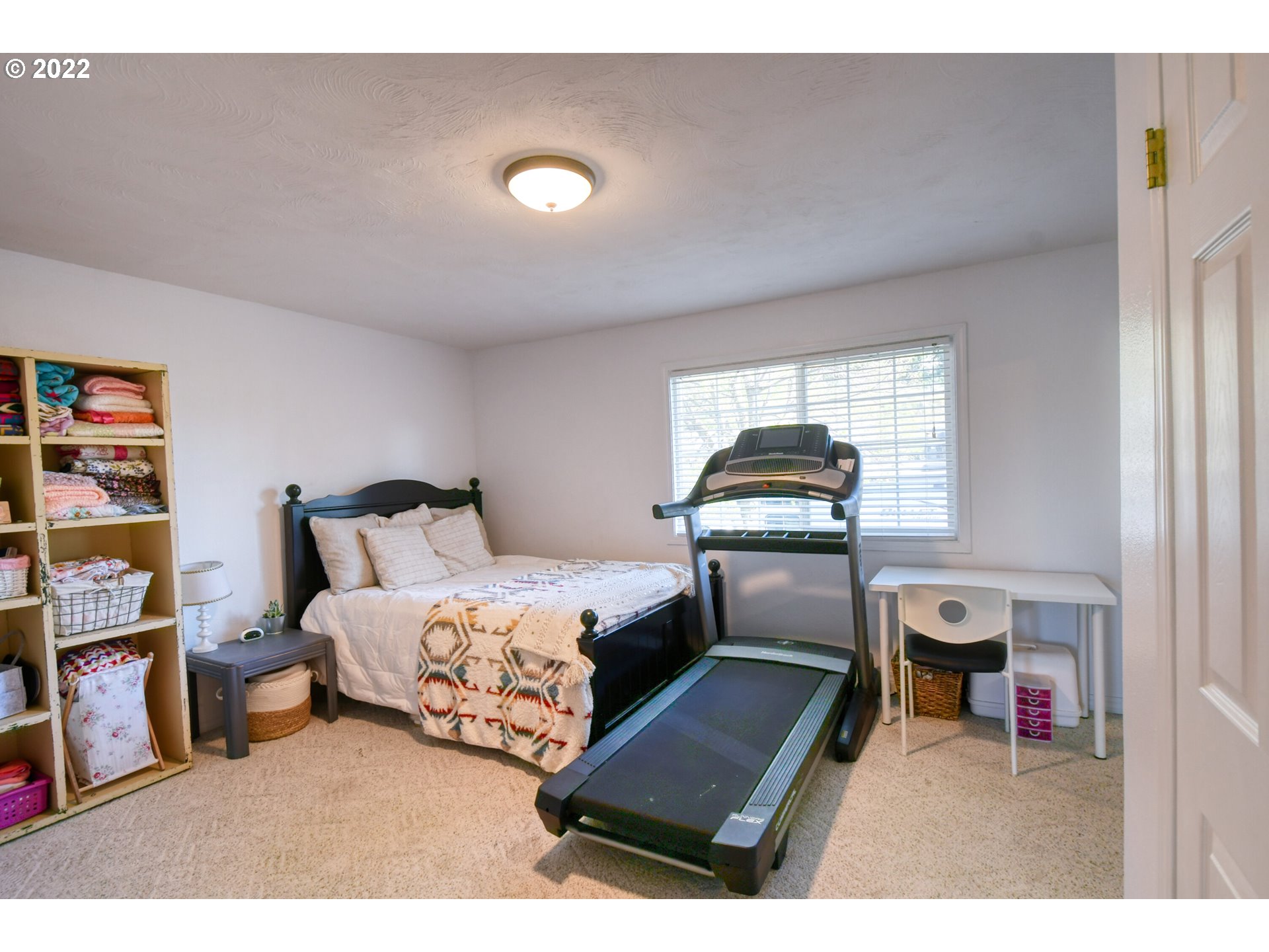 2209 Southwest Ladow Avenue Pendleton, OR 97801 - Photo 21 of 24 a bedroom with furniture and natural light